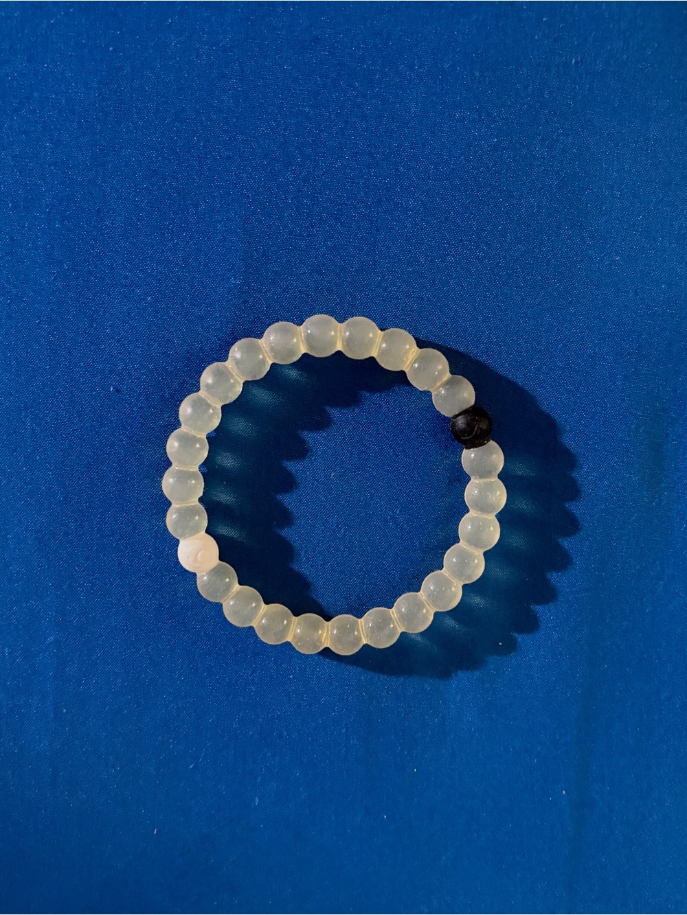 Stretch Beaded Bracelet in Translucent White with Single Black Accent